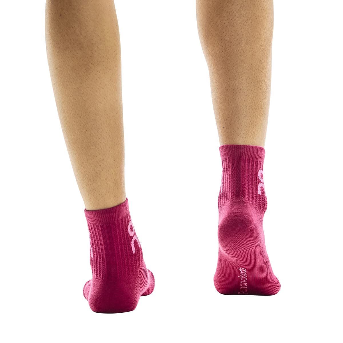 Rear view of model wearing the red pair from the On Logo Sock Mid 3-Pack in Orchid Comet #color_orchid-comet