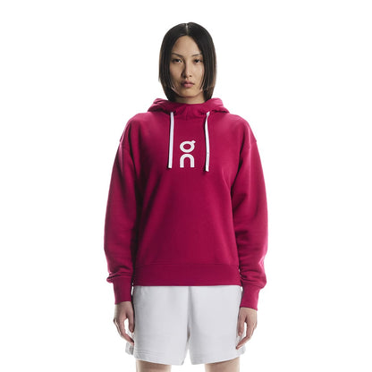 Female model wearing the On Apparel - Club Hoodie Colour Grenadine, shown from the front 