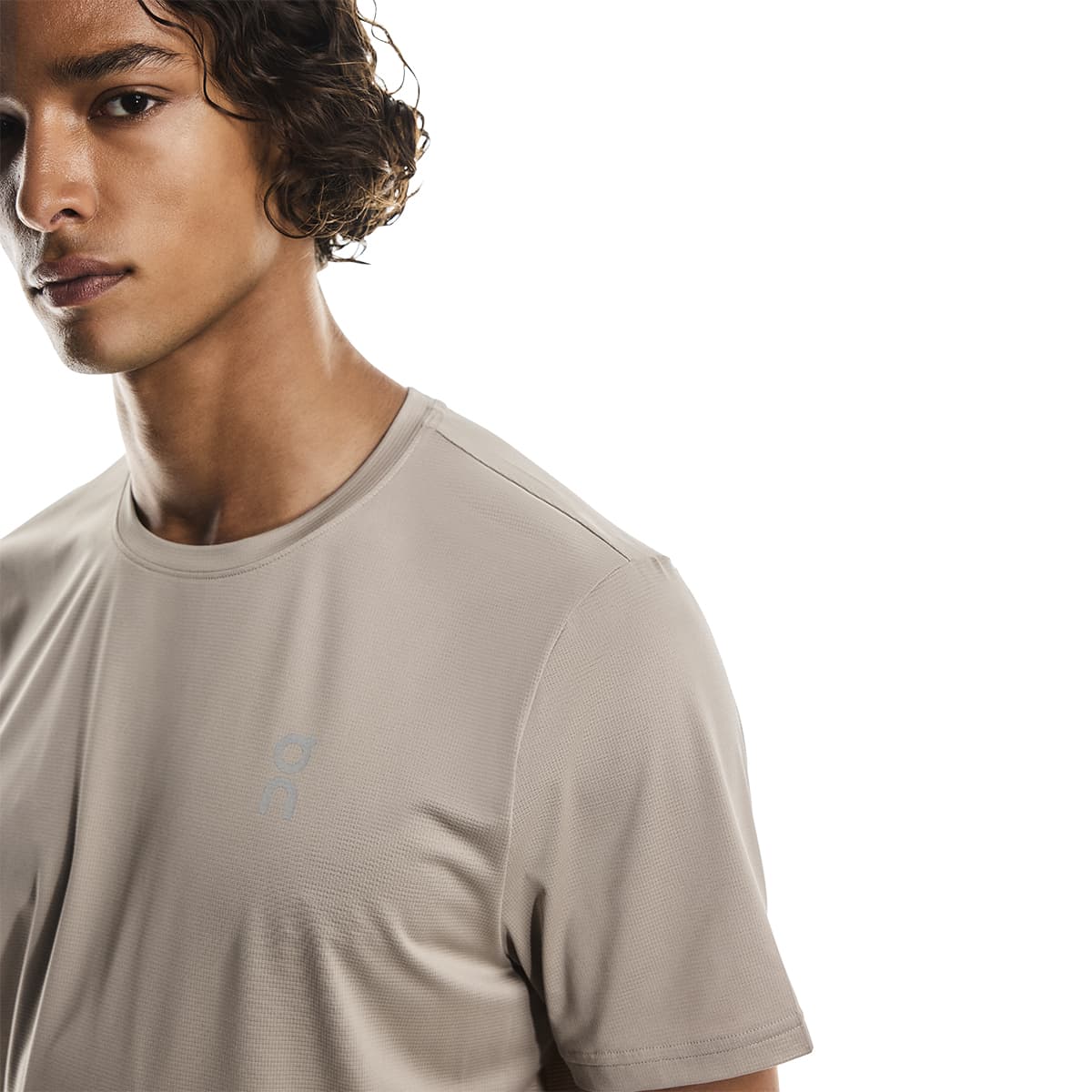 Close-up of male model wearing the On Apparel - Core T Colour Desert 