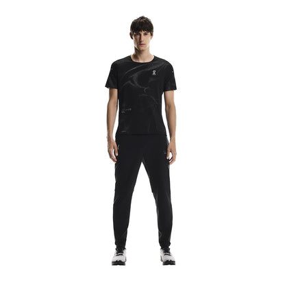 Full-body of male model wearing the On Apparel - Performance T Lumos Colour Black 