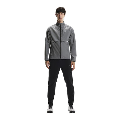 Full body shot of male model wearing the On Weather Jacket Lumos Colour Eclipse 