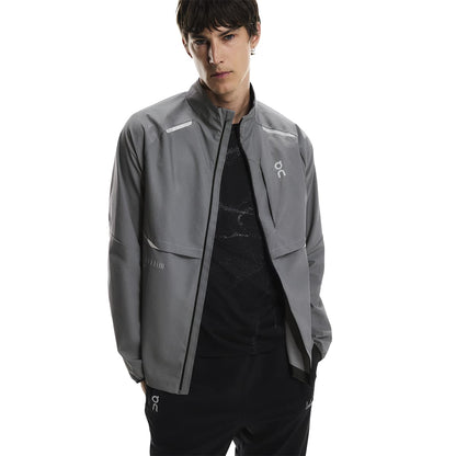 Front view of a male model wearing the On Weather Jacket Lumos Colour Eclipse 