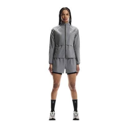 Full body shot of female model wearing the On Weather Jacket Lumos Colour Eclipse 