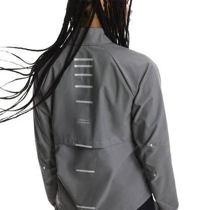 Close up rear view of a female model wearing the On Weather Jacket Lumos Colour Eclipse 