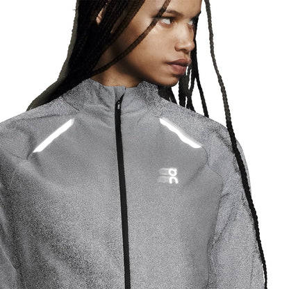 Front view of a female model wearing the Reflective On Weather Jacket Lumos Colour Eclipse 