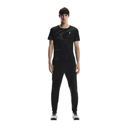 Full front view of male model wearing the On Weather Pants Lumos in Black paired with matching top 
