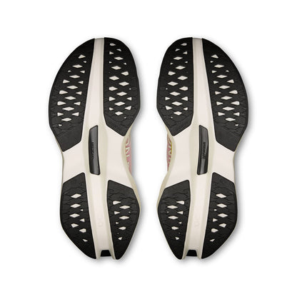 Soles of the On Cloudboom Max Lime-Raspberry women’s running shoes 