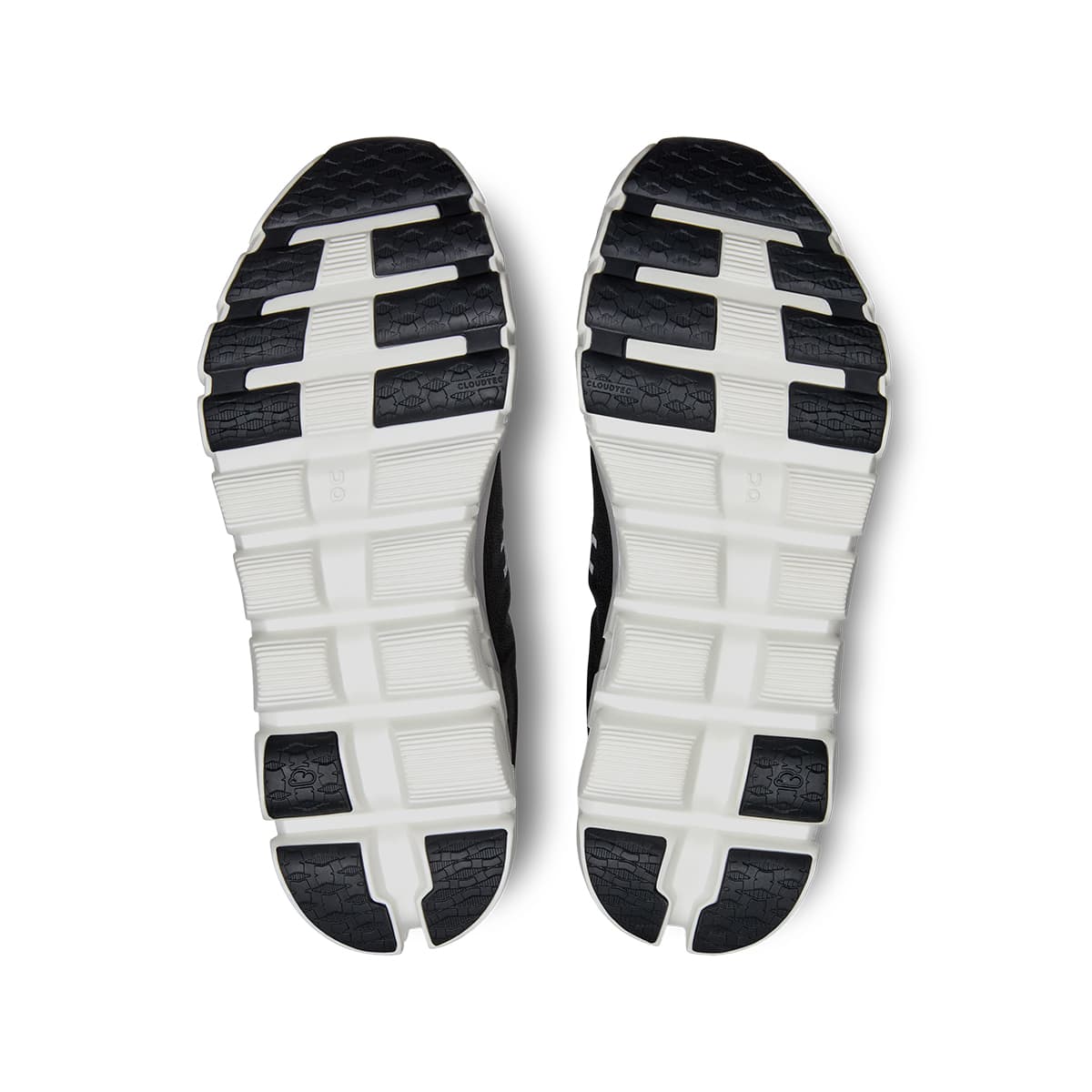 Soles of the On Cloudflow 4 Black-White women’s running shoes 