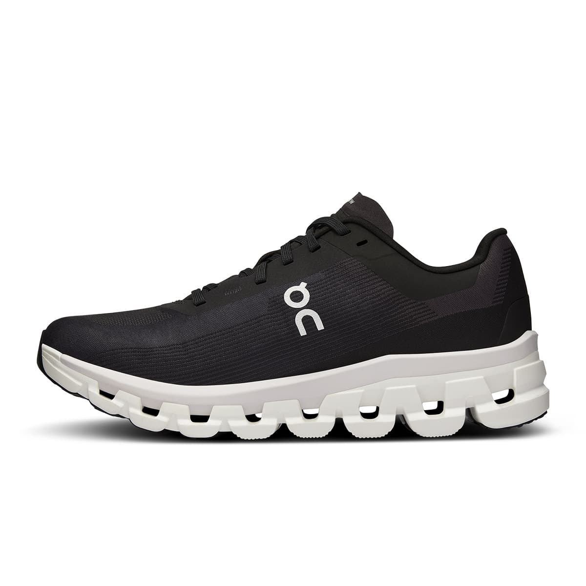 Left side view of the On Cloudflow 4 Black-White women’s running shoe 