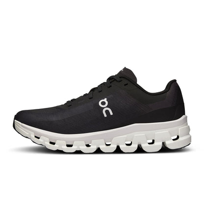 Left side view of the On Cloudflow 4 Black-White women’s running shoe 