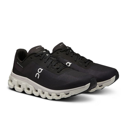 45-degree view of the On Cloudflow 4 Black-White women’s running shoe 
