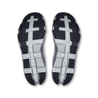 Soles of the On Cloudmonster Hyper Glacier Ivory women’s running shoes 