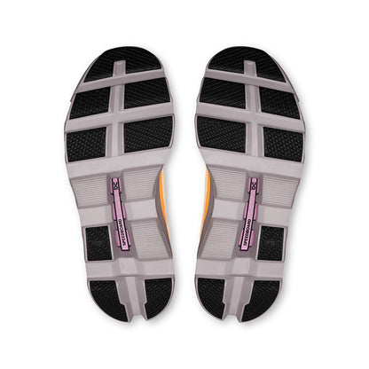 Soles of the On Cloudmonster Blonde-Fade women’s running shoes 