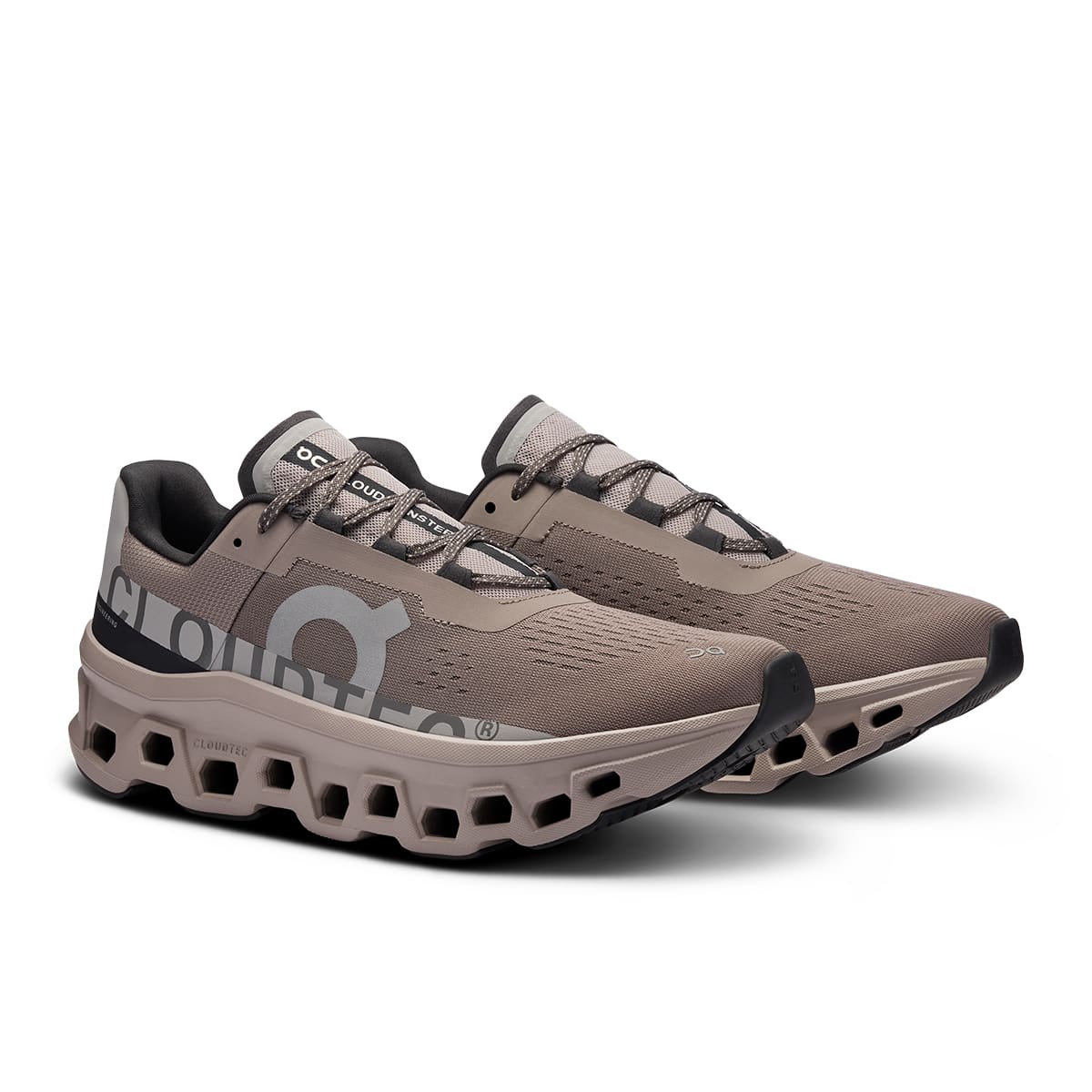 45-degree view of the On Cloudmonster Cinder Fog men's running shoe 