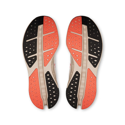 Soles of the On Cloudsurfer Max Ivory-Salmon men’s running shoes 