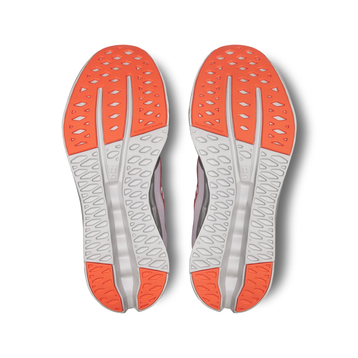 Soles of the On Cloudsurfer Auburn-Frost women’s running shoes #color_auburn-frost