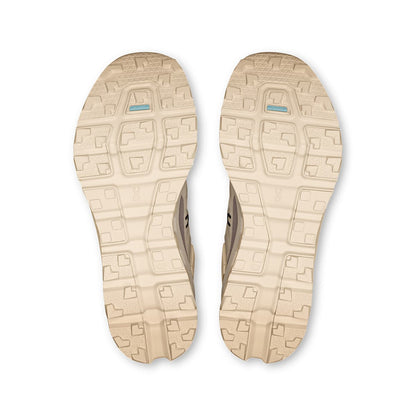 Soles of the On Cloudvista 2 Cream Desert women’s running shoes 
