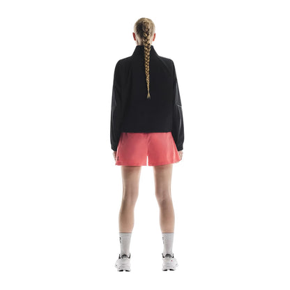 Woman wearing the On Focus Shorts Colour Coral - Read View 