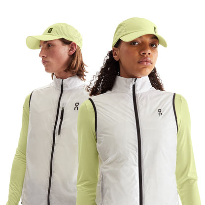 Models wearing the On Lightweight Cap Colour Hay 