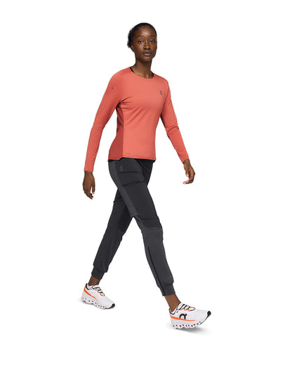 Woman wearing the On Weather Pants Colour Black - Front Side View 