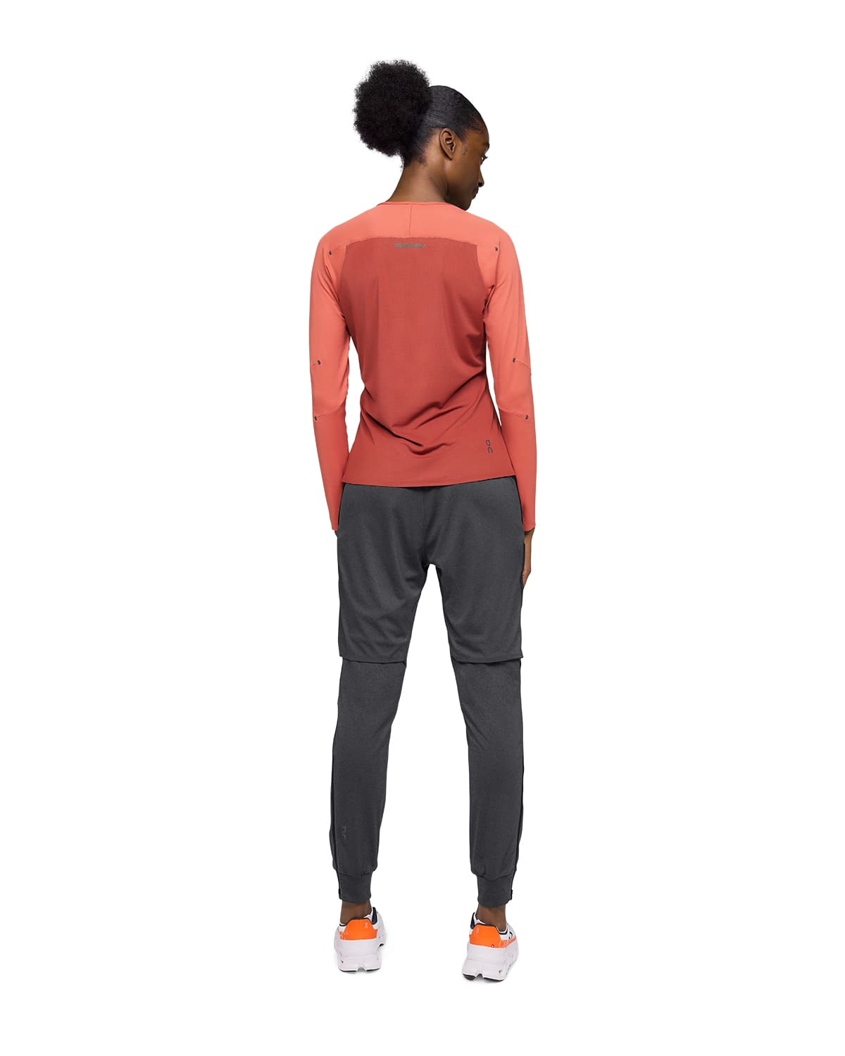 Woman wearing the On Weather Pants Colour Black - Back View 