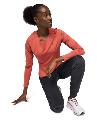 Woman wearing the On Weather Pants Colour Black - Knee Cutout 