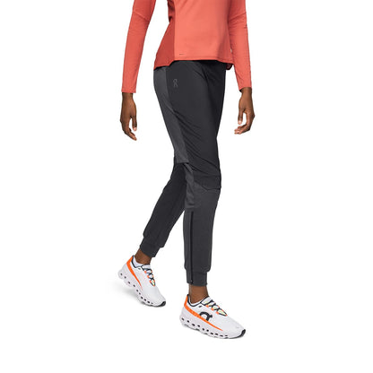 Woman wearing the On Weather Pants Colour Black - Front View Zoomed 