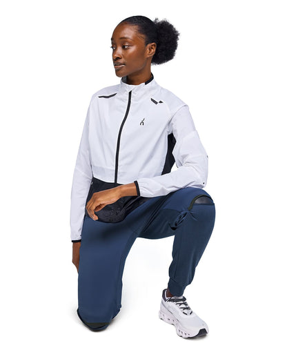 Woman wearing the On Weather Pants Colour Denim Navy 