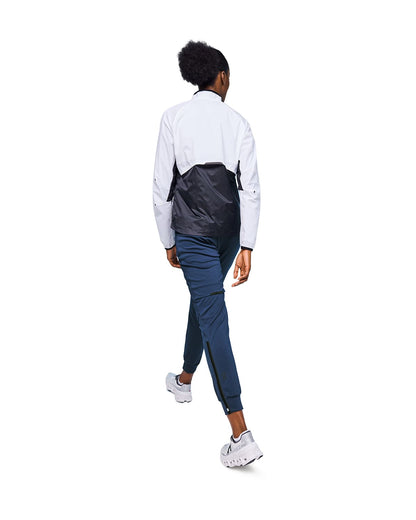 Woman wearing the On Weather Pants Colour Denim Navy - Back View 