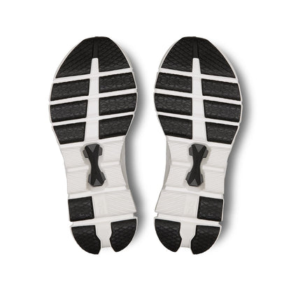Soles of the On Cloud X4 Ivory-Black women’s running shoes 