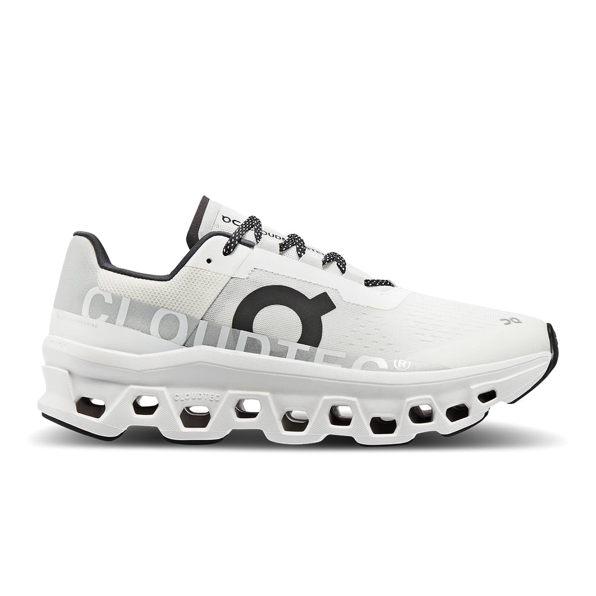 Right side view of the On Cloudmonster All White women’s running shoe 