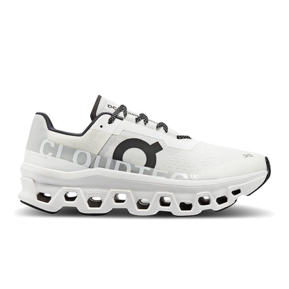 Right side view of the On Cloudmonster All White women’s running shoe 