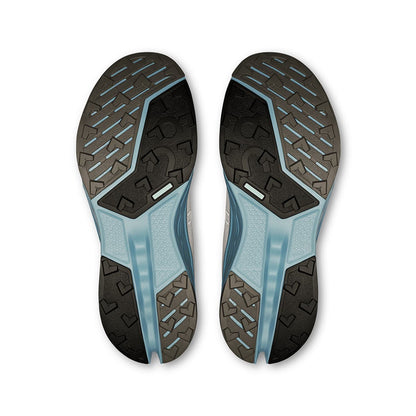 Soles of the On Cloudsurfer 2 Trail Glacier-Dust women’s running shoes 