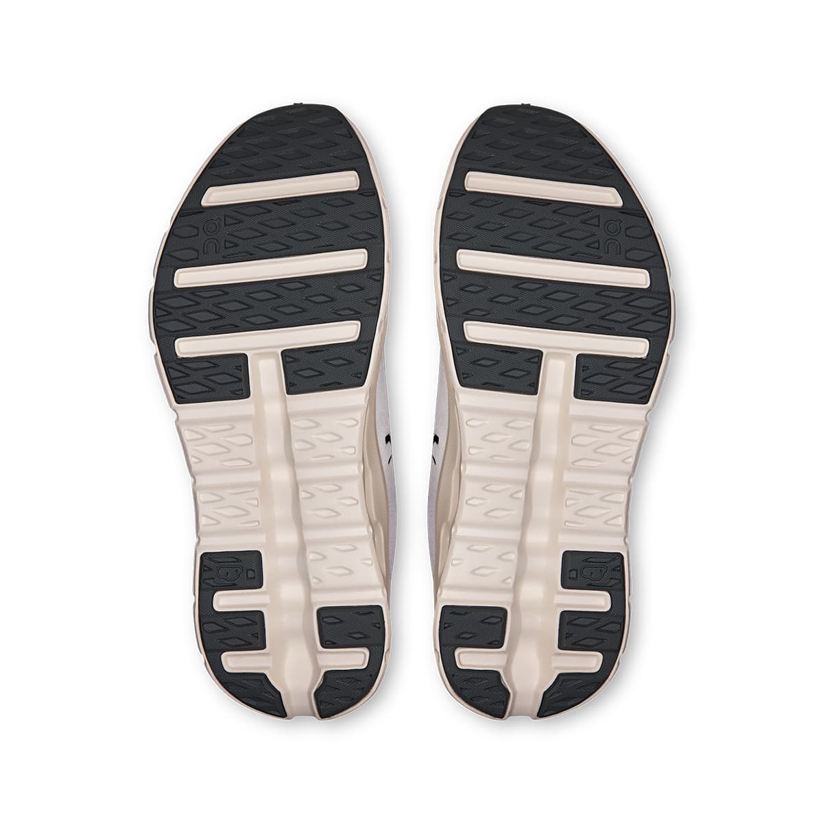 Soles of the On Cloudtilt Rock Ivory men’s running shoes 