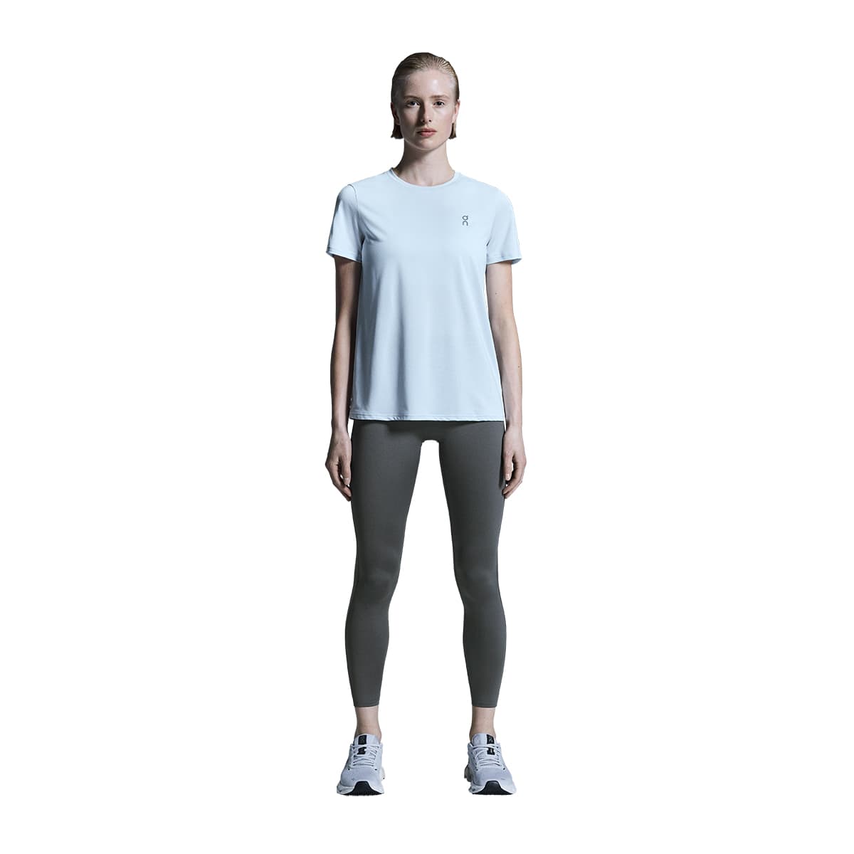 Woman wearing the On Core T Colour Arctic #color_arctic