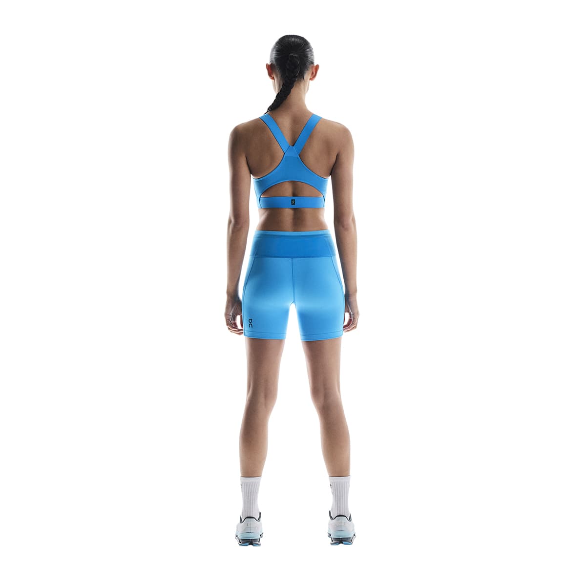 Woman wearing the On Performance Flex Bra Colour Malibu - Rear View #color_malibu