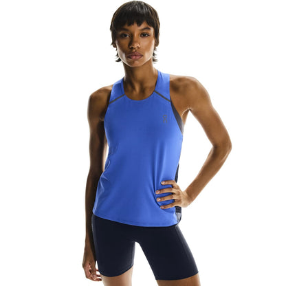Front close-up of female model wearing the On Performance Tank in Zaffre Navy 