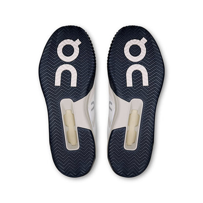 Soles of the On The Roger Advantage Pro Clay White-Cream men’s running shoes 