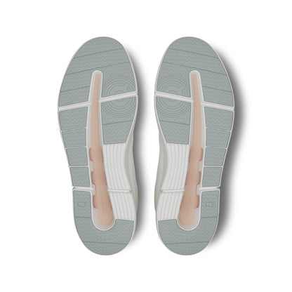 Soles of the On The Roger Advantage White Rosehip women’s running shoes 