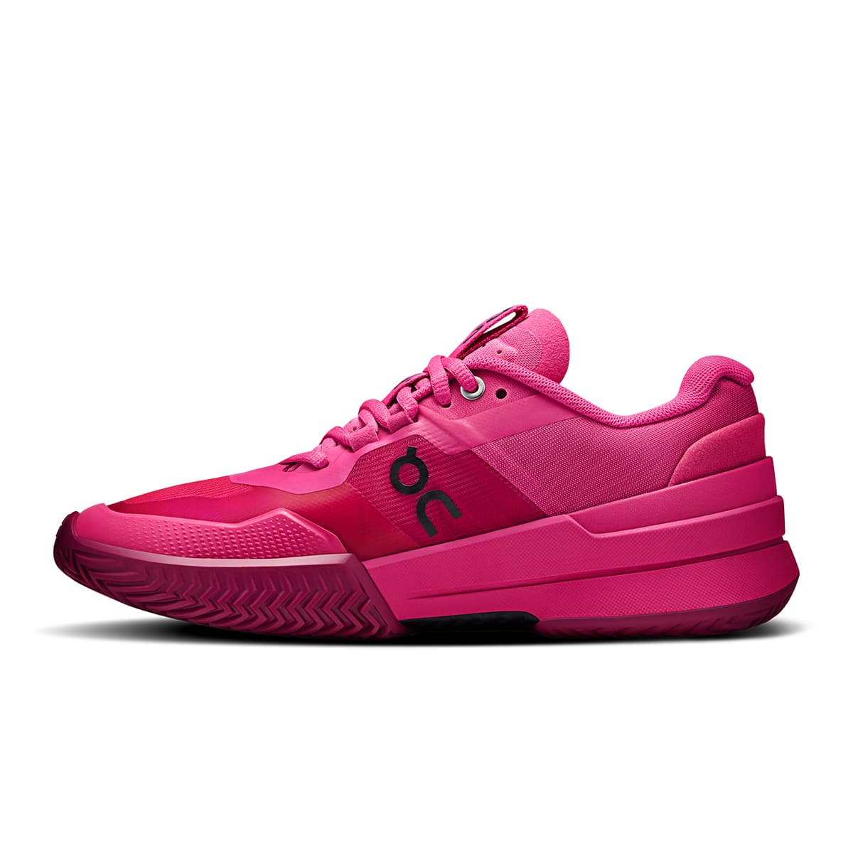 Left side view of the On The Roger Pro 2 Pink Grenadine women’s tennis shoe 