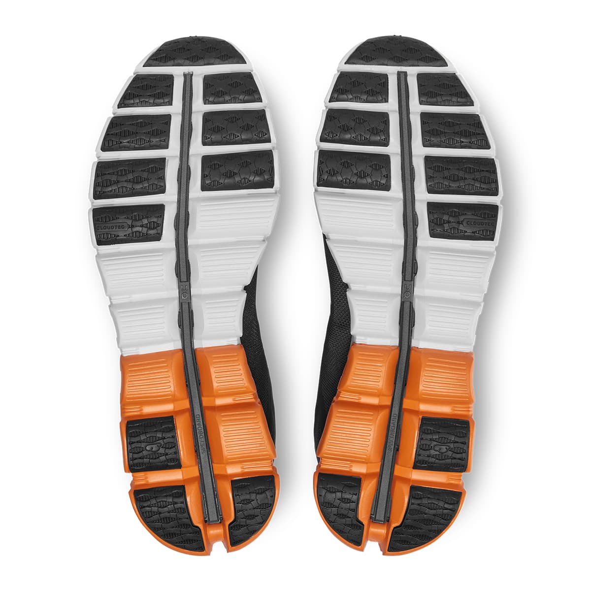 Soles of the On Cloudflow Black-Tumeric men’s running shoes #color_black-turmeric
