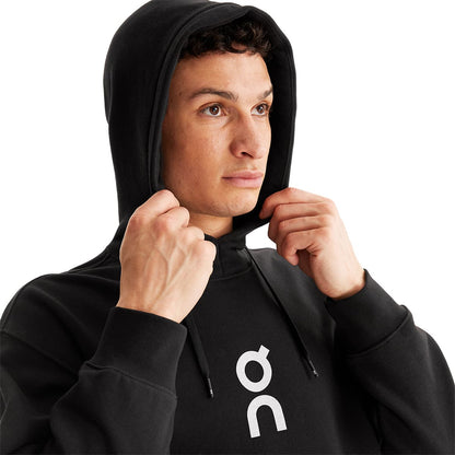 Man wearing the On Club Hoodie Colour Black - Close Up front Hood 
