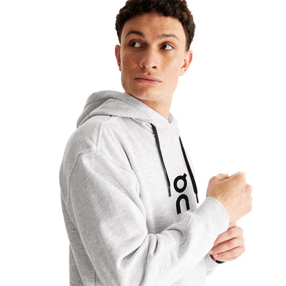 Man wearing the On Club Hoodie Colour Crater - Close Up side front view 