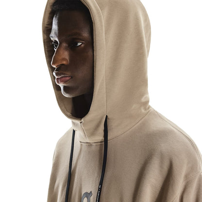Close-up side profile of male model wearing the hood up on the On Club Hoodie in Desert 