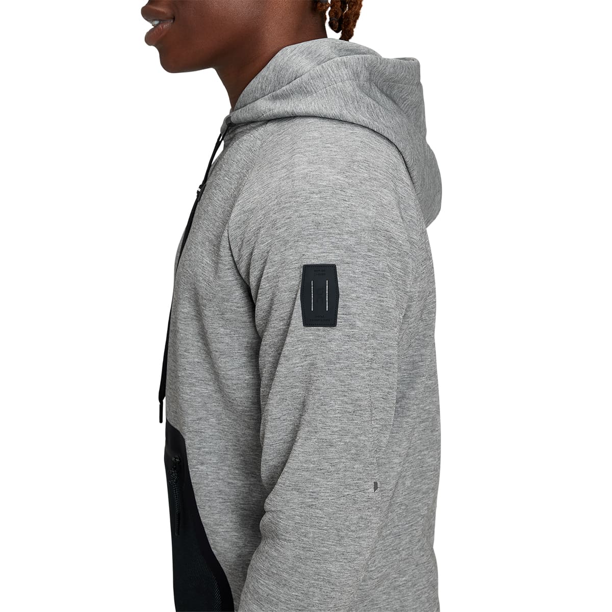Man wearing the On Hoodie Colour Grey - Detail Side Arm  