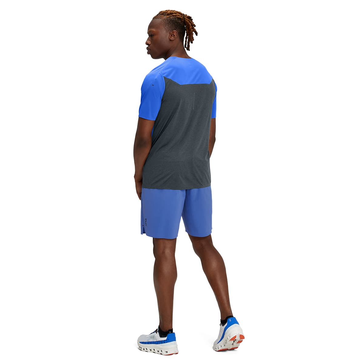 Man wearing the On Hybrid Shorts Colour Cobalt - Back View #color_cobalt