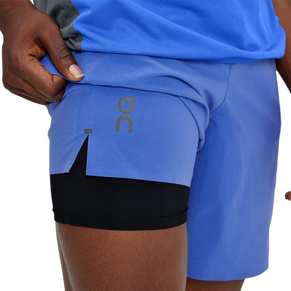 Man wearing the On Hybrid Shorts Colour Cobalt - 2 in 1 Shorts 