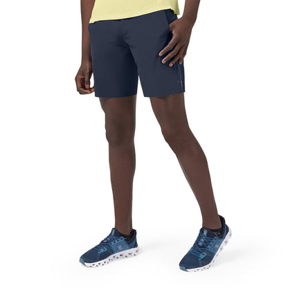 Man wearing the On Hybrid Shorts Colour Navy 