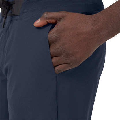 Man wearing the On Hybrid Shorts Colour Navy - Side Pocket 