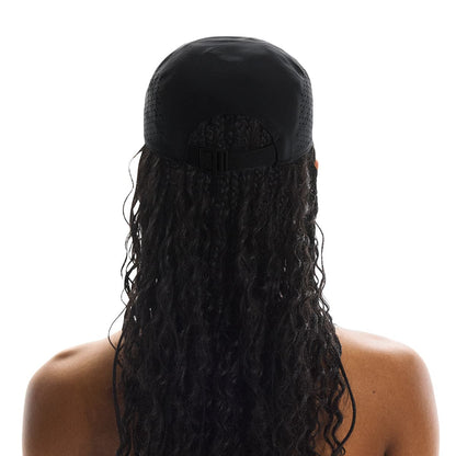 Rear view of female model wearing the On Lightweight Cap in Black showing adjustable strap 